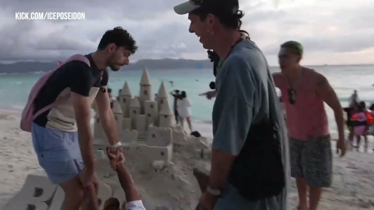 Ice Poseidon and Sam Pepper destroy a sandcastle by throwing Deepak on it